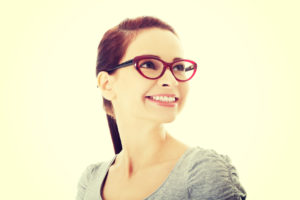 Portrait of beautiful woman in red eyeglasses.