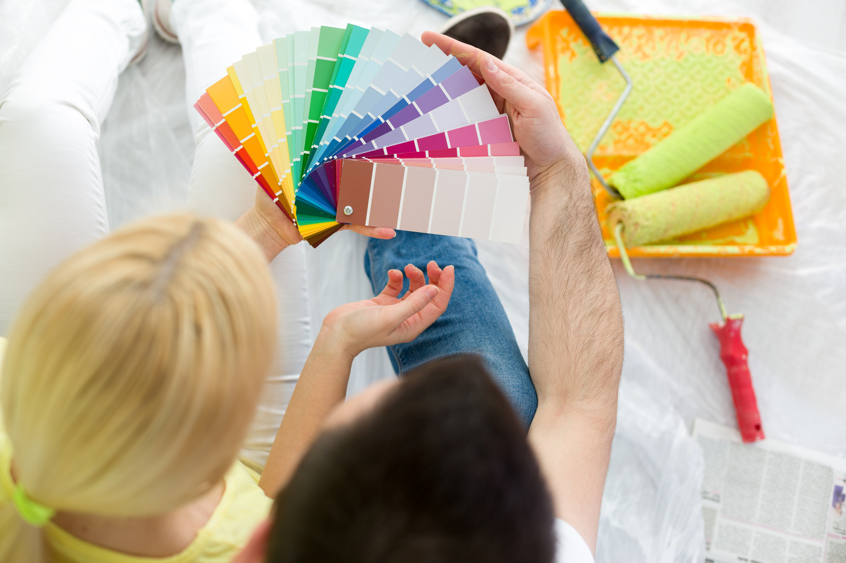 couple choosing colors to paint new house