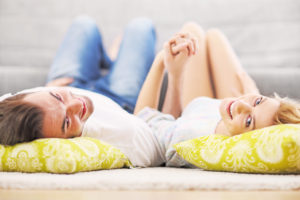 Adult couple relaxing at home