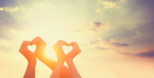 Two hands on sunsut.