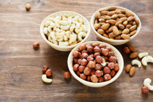 three kinds of nuts in a bowl