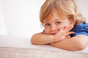Portrait Of Smiling Young Boy Playing Outside