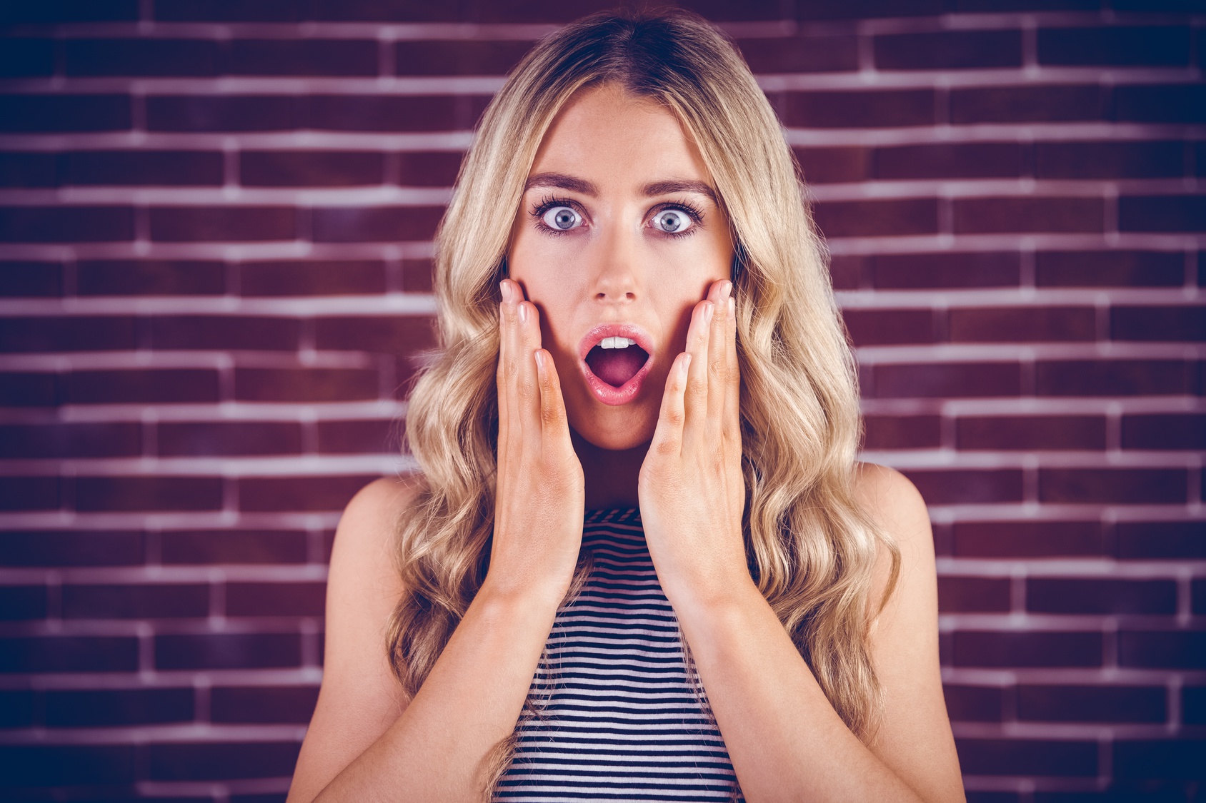 Beautiful blonde woman being shocked