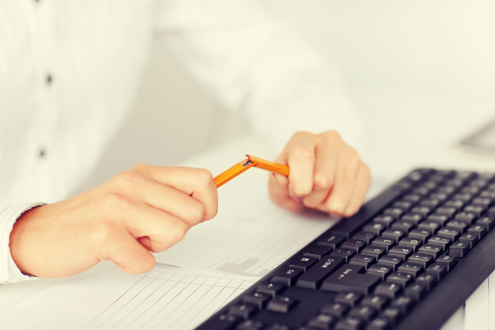 woman breaking pencil