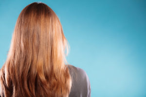 female brown long healthy loose hair rear view