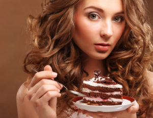 beautiful young woman with a cake