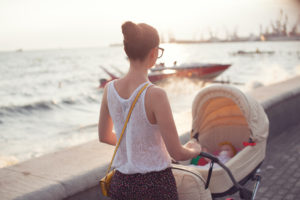 Mother strolling with newborn