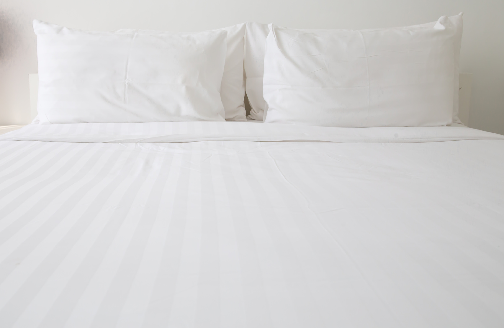 White bed sheets and pillows