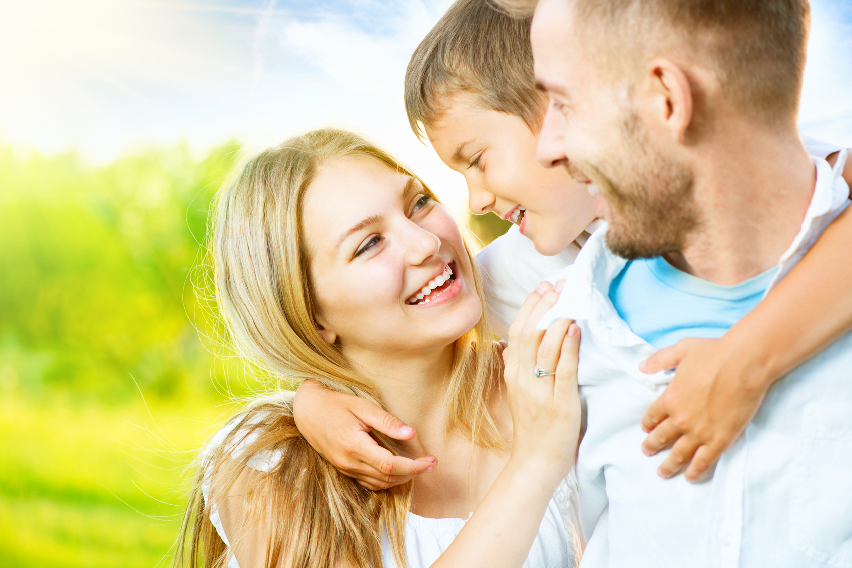 Happy joyful young family having fun outdoors