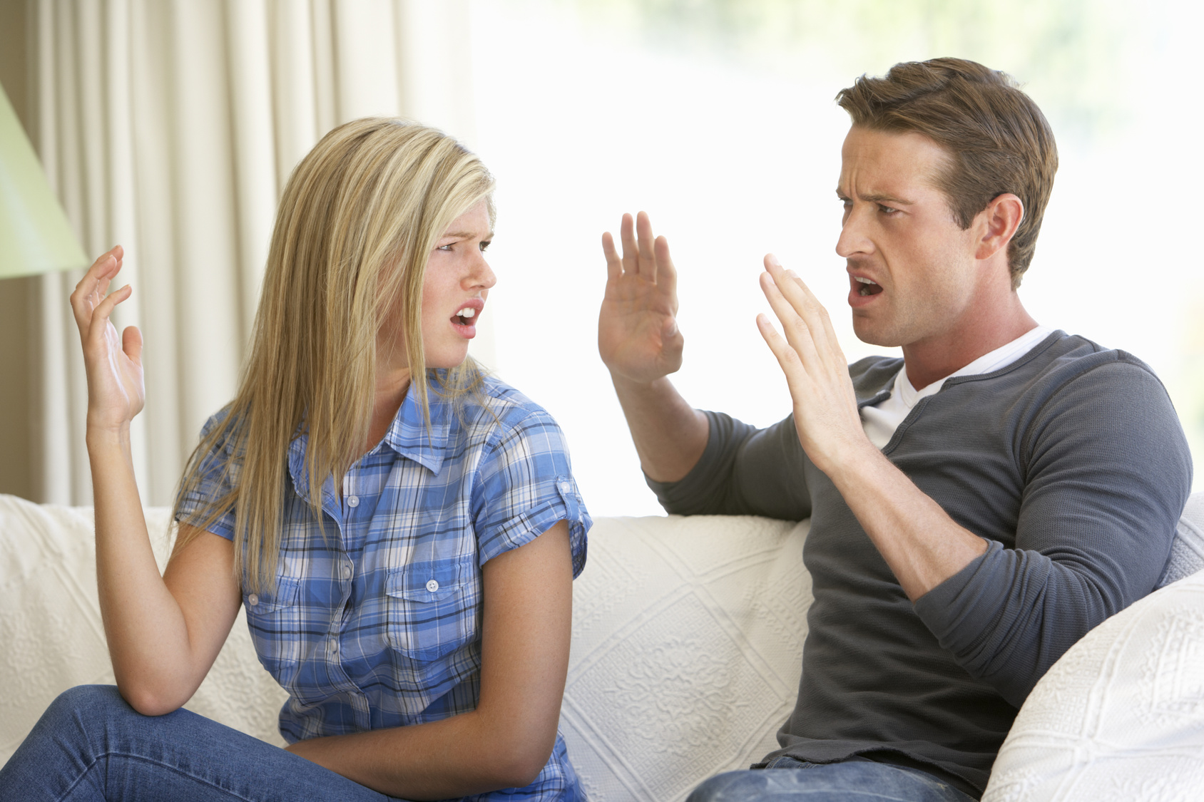 Young Couple Having Argument At Home