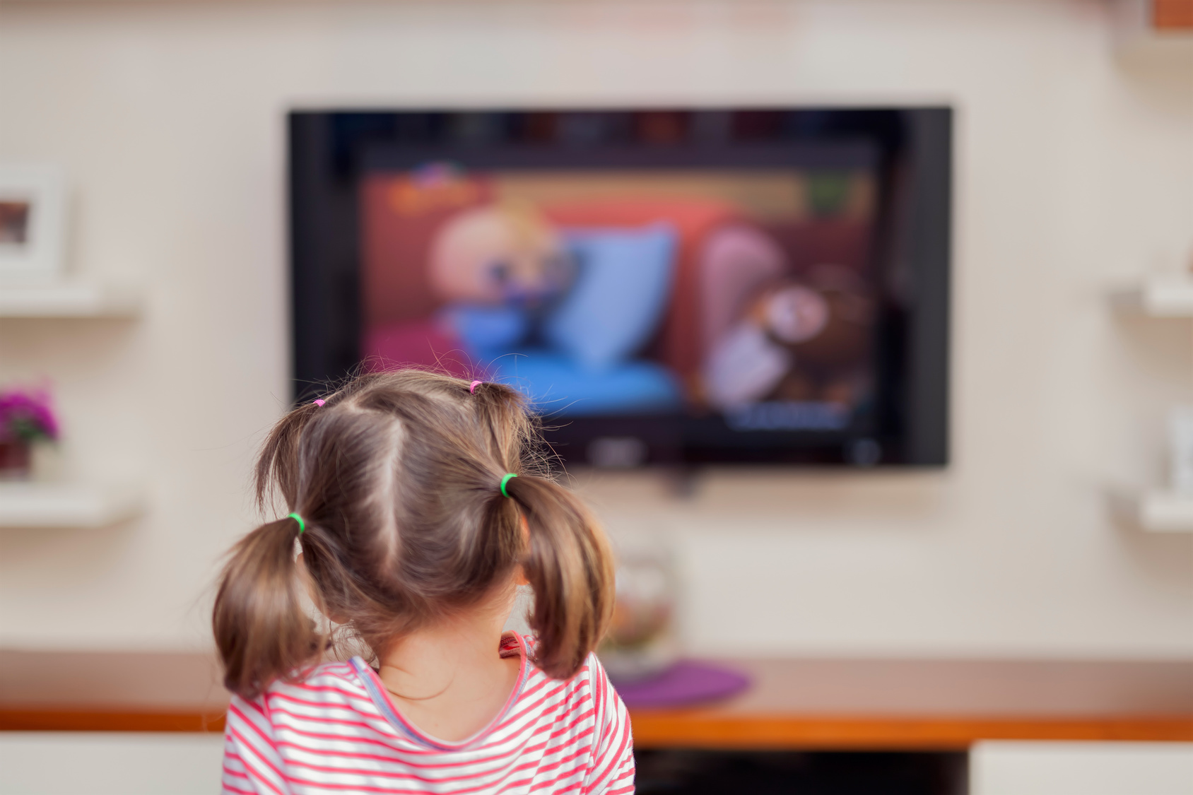 little cute girl watching tv