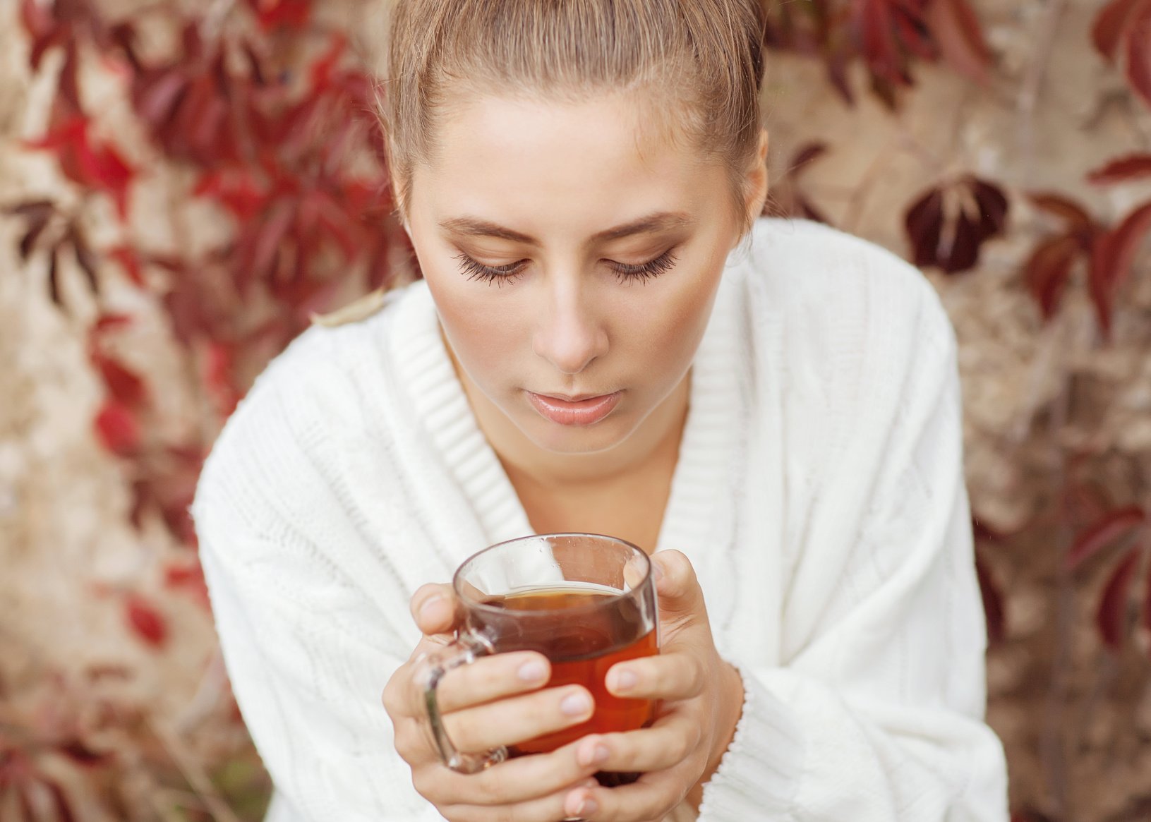 Girl enjoying a large cup of freshly brewed hot tea