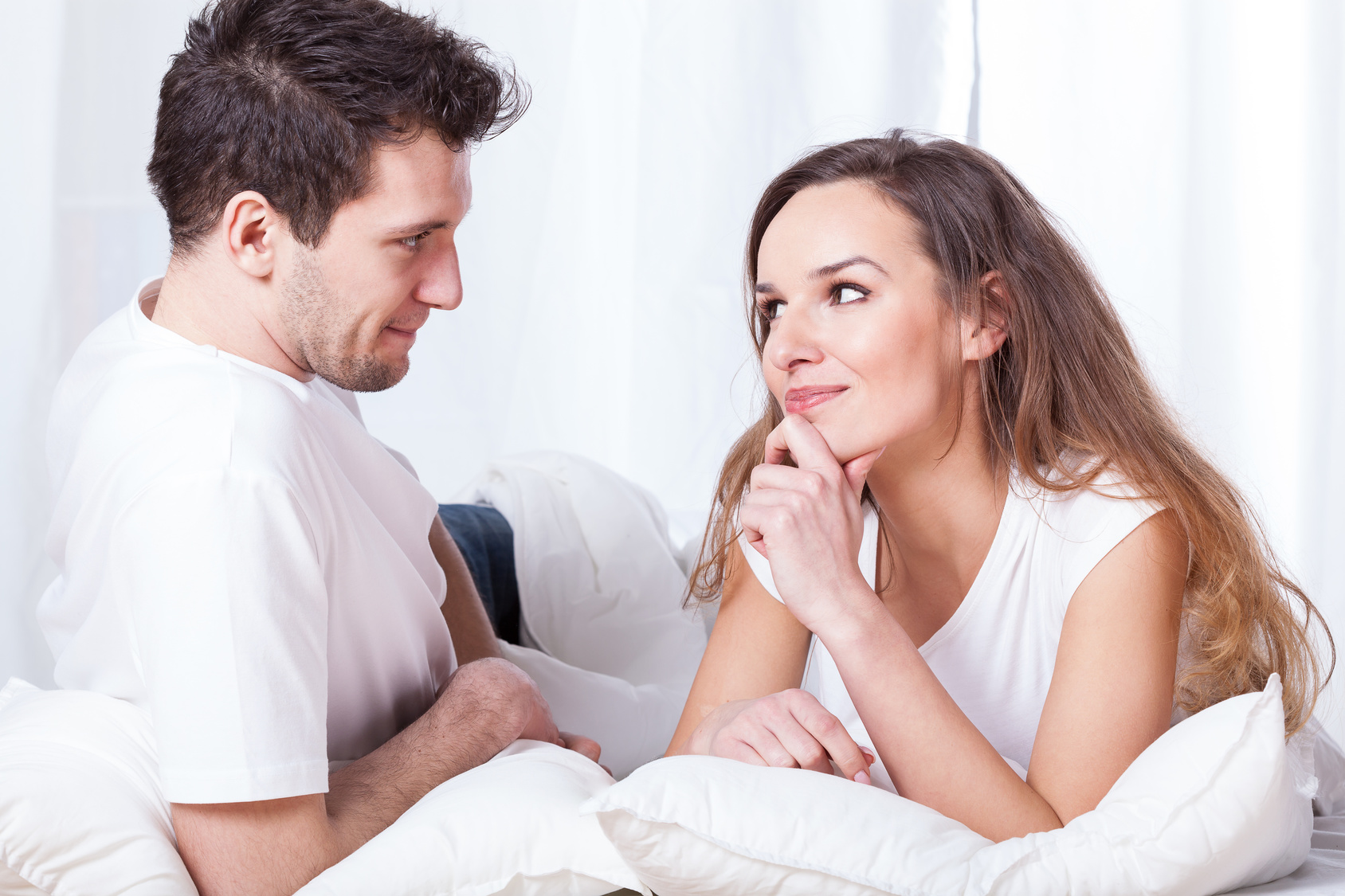 A couple contemplating in bed