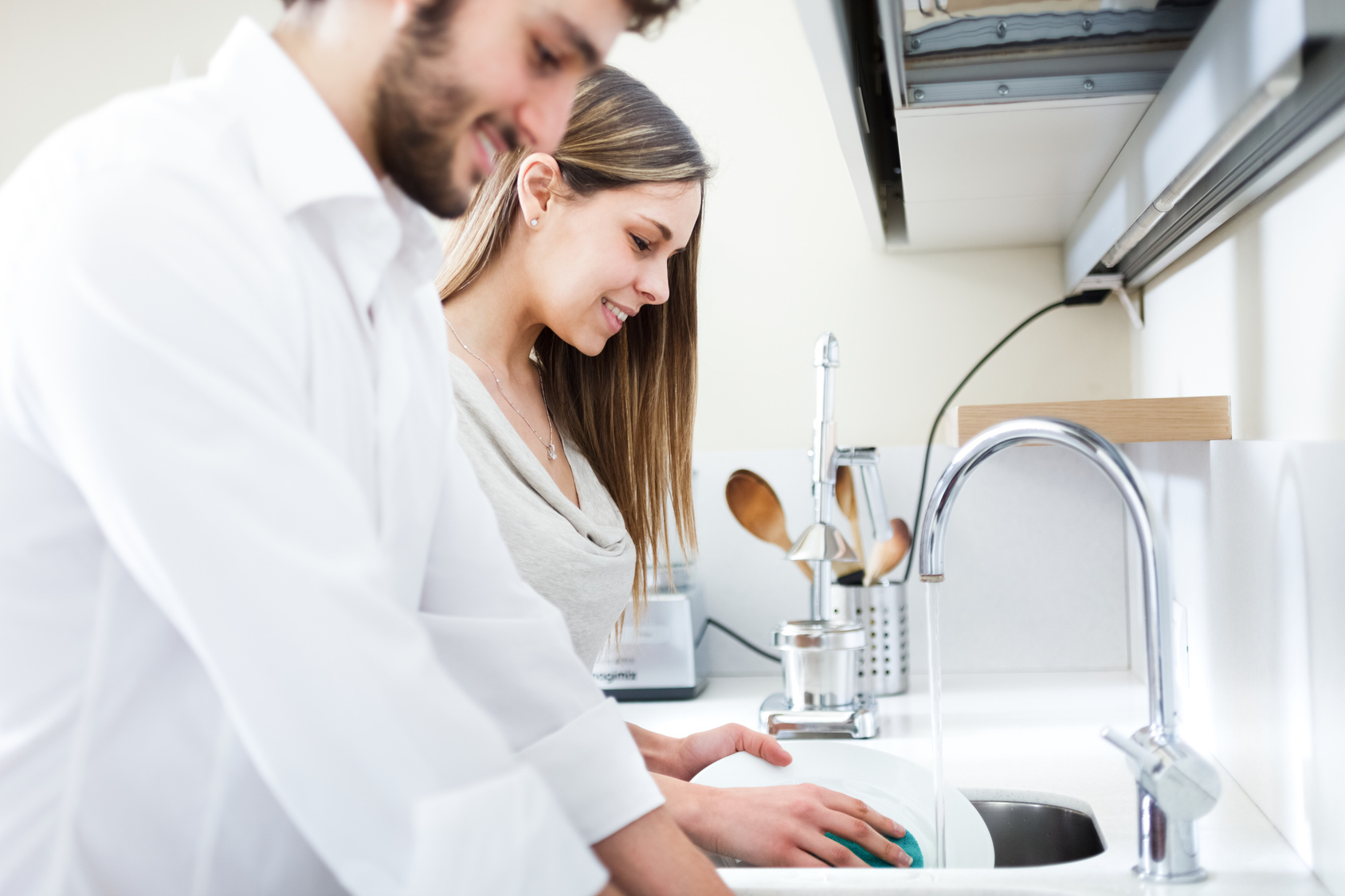 Young couple doing dishes