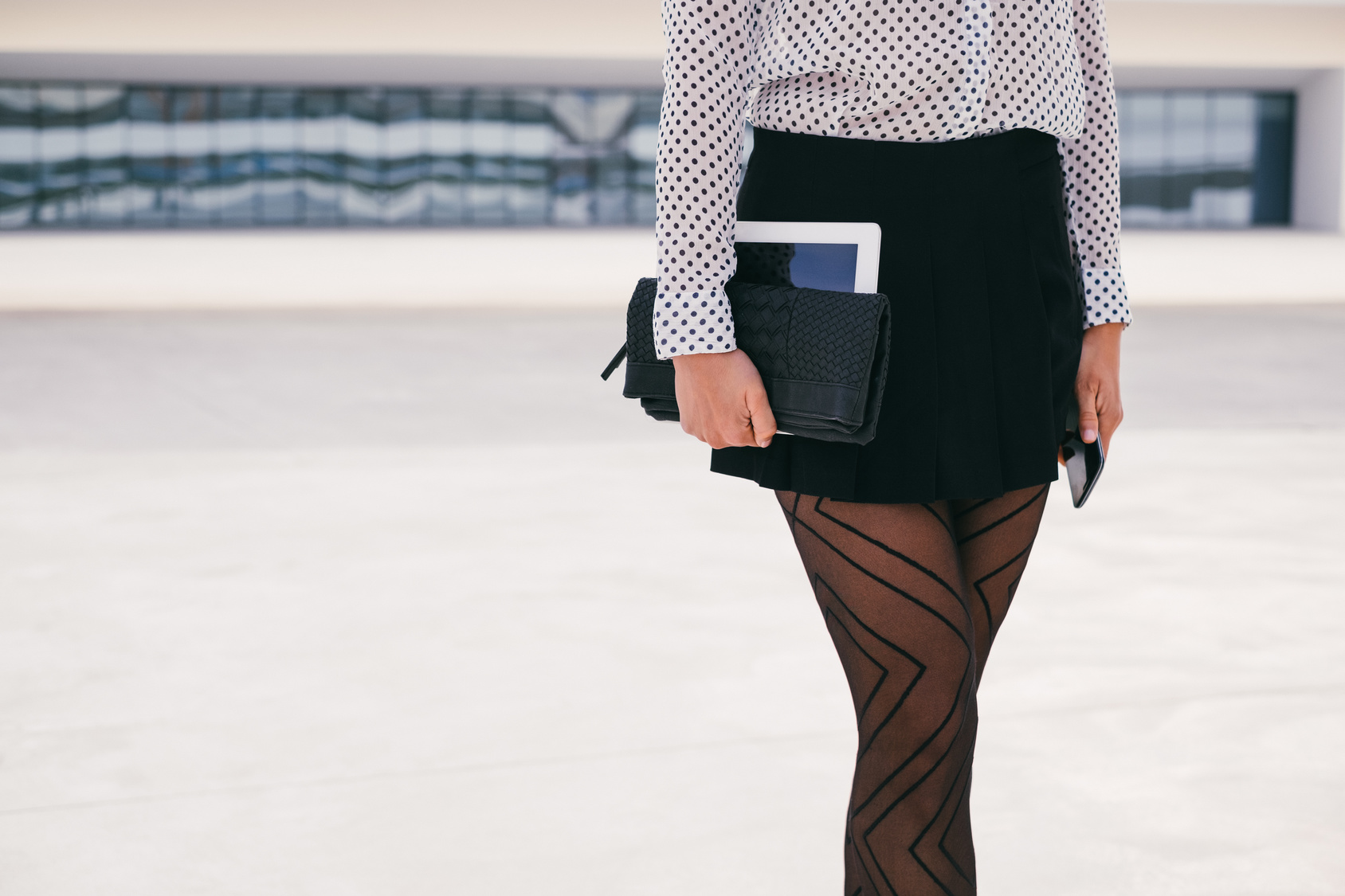 Trendy business professional woman holding digital tablet