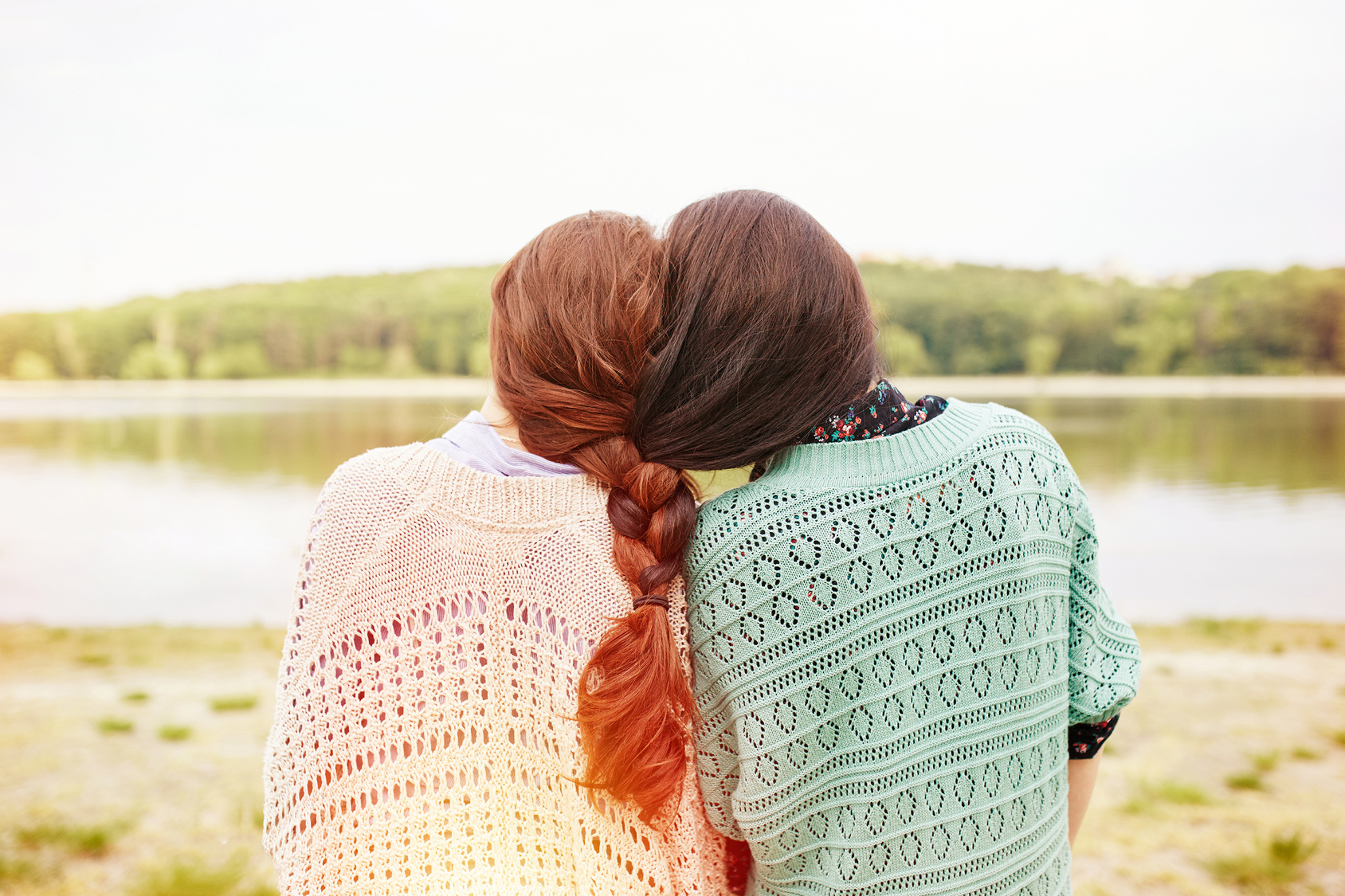 Two sisters with interwoven hairs