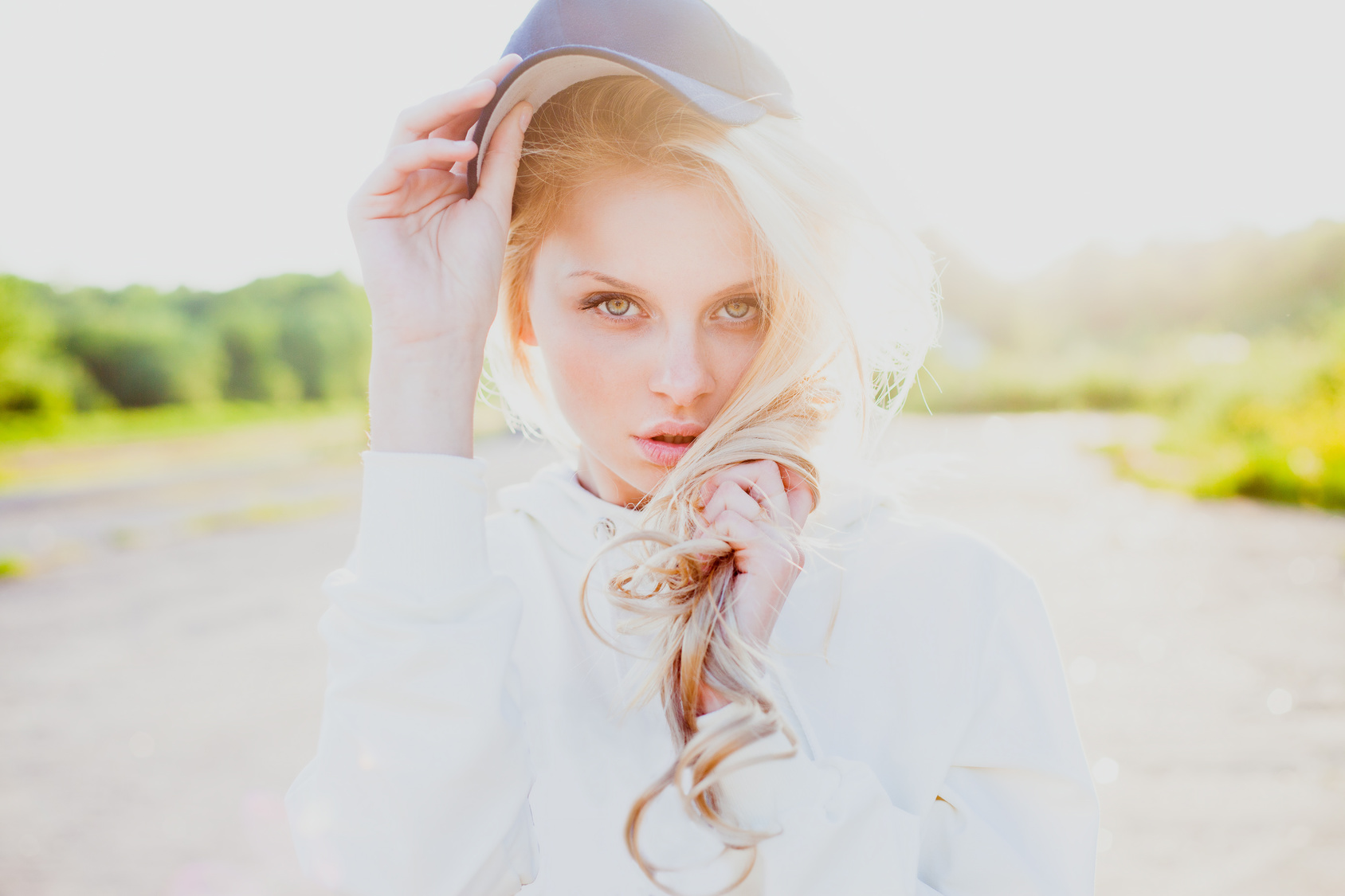 Beautiful girl outdoor in the park looking at you