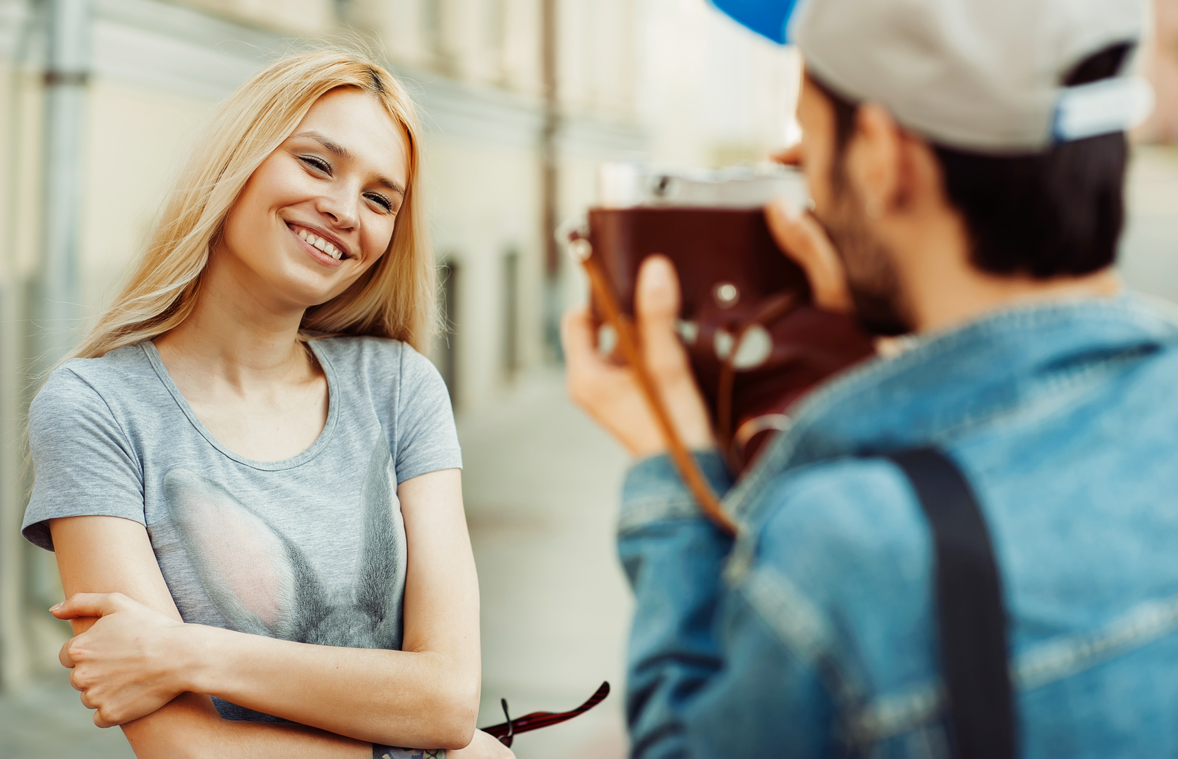 Couple taking self portrait photos with old camera