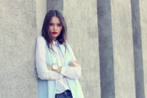 high fashion portrait of young elegant woman outdoor