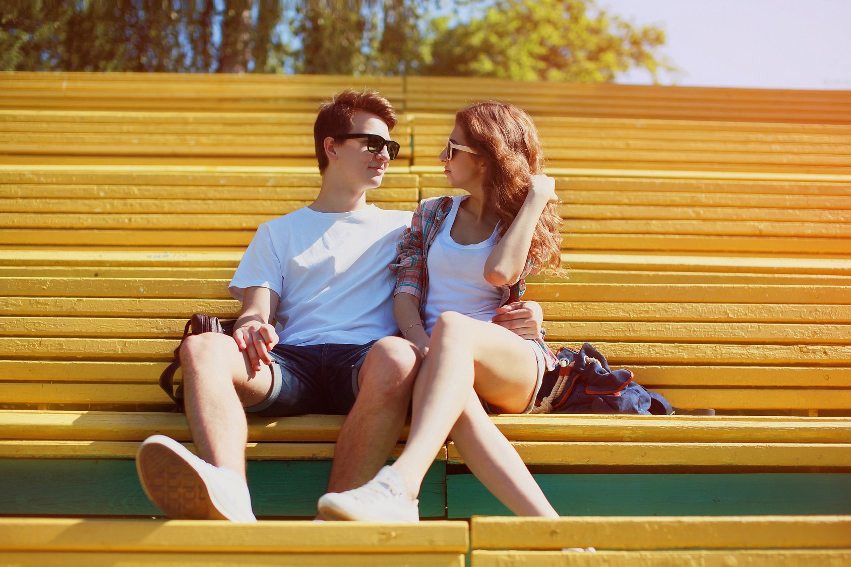 Sunny portrait young couple in love summer, stylish teenagers