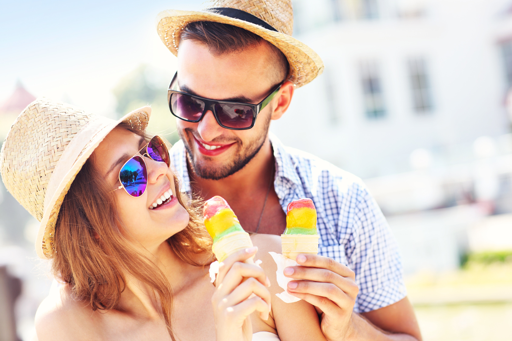 Lovely couple eating ice-cream in the city