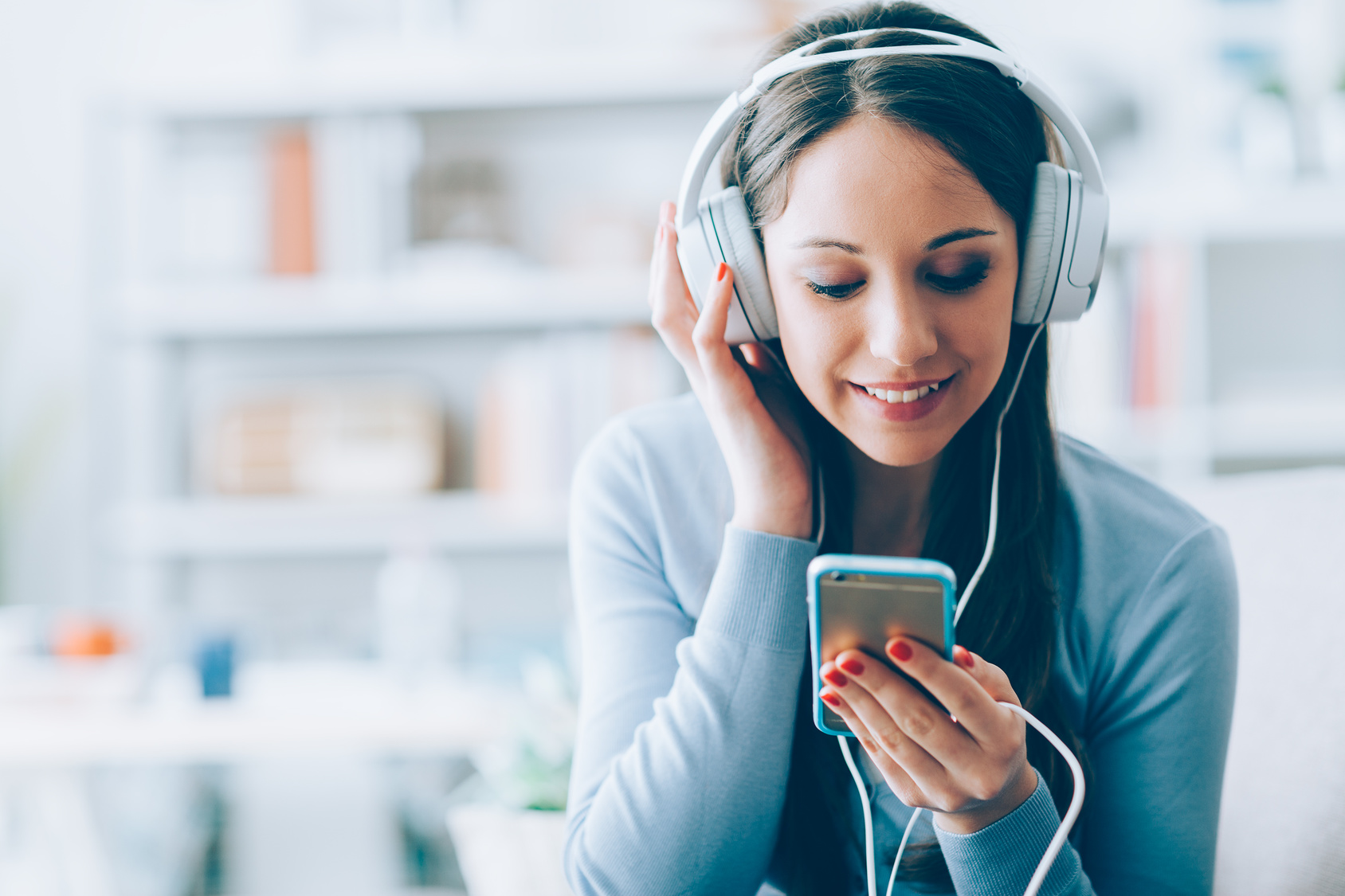 Girl listening to music with her smartphone