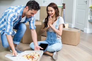 Cheerful couple having pizza
