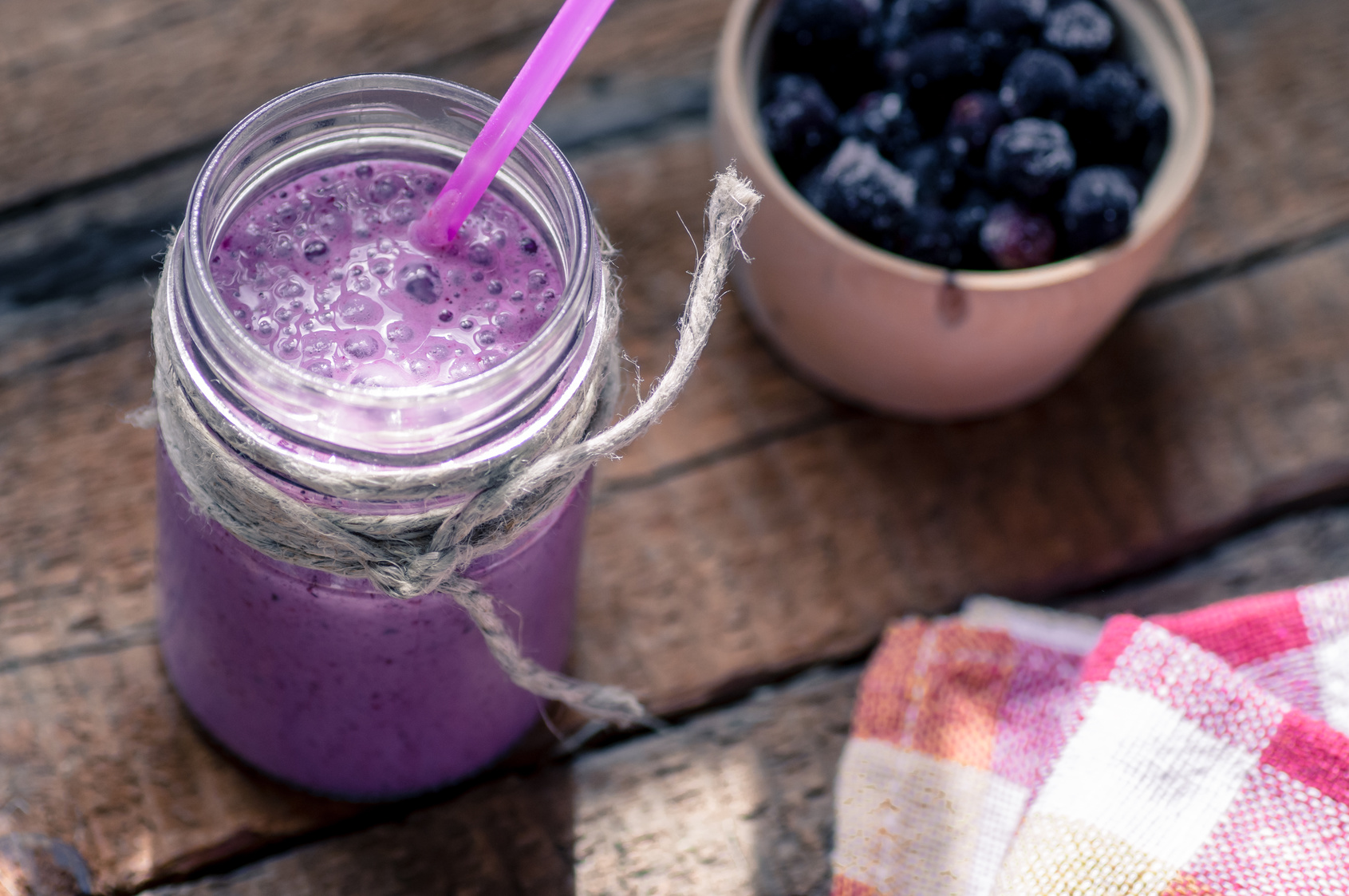 On the table with a glass of smoothie