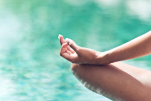 Graceful hand gesture of a woman meditating