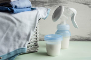 manual breast pump, baby bottle with milk