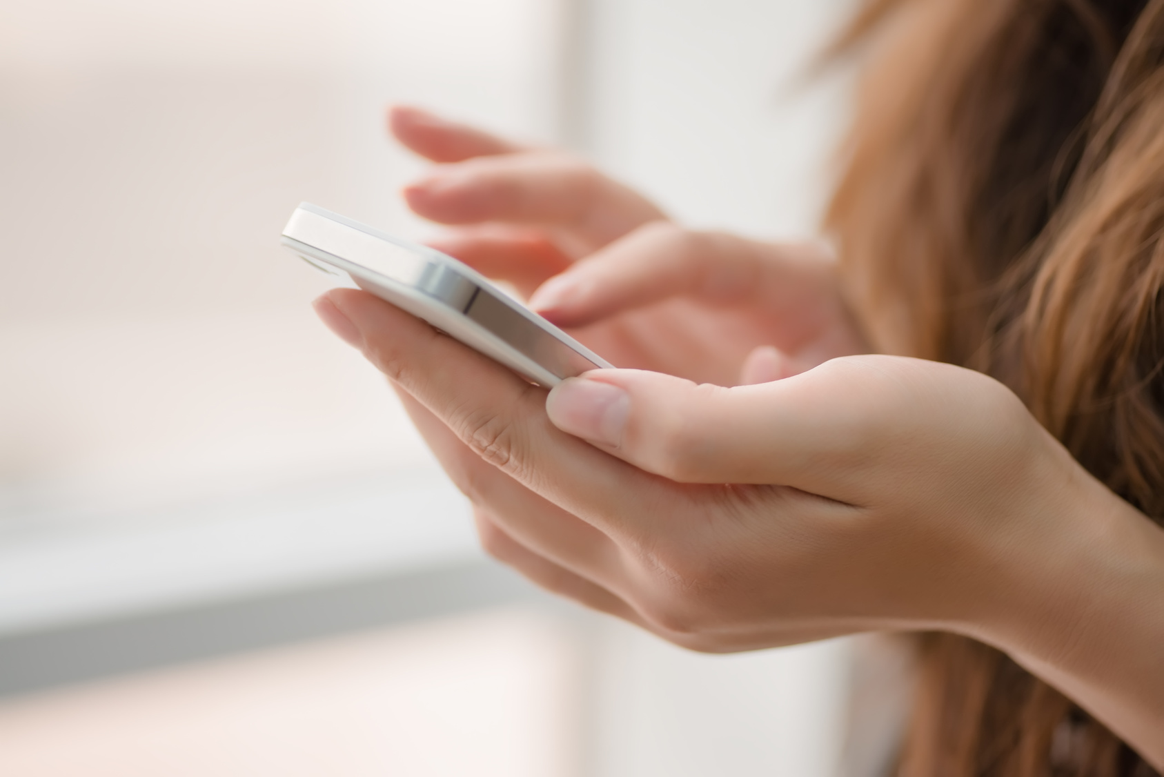 woman uses a smartphone