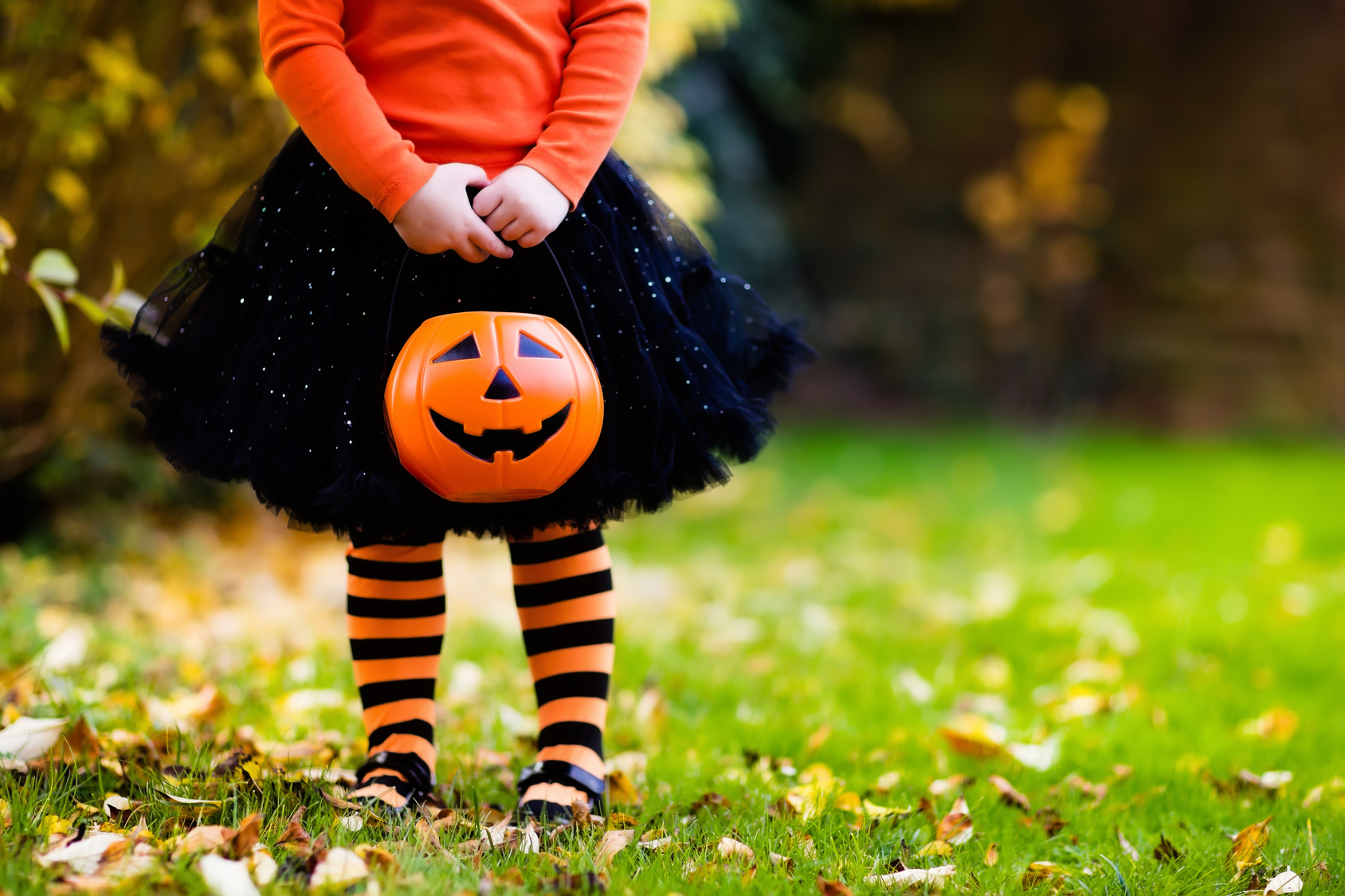 Little girl having fun on Halloween trick or treat