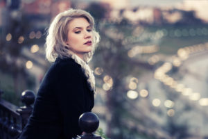 Young fashion woman on the city street