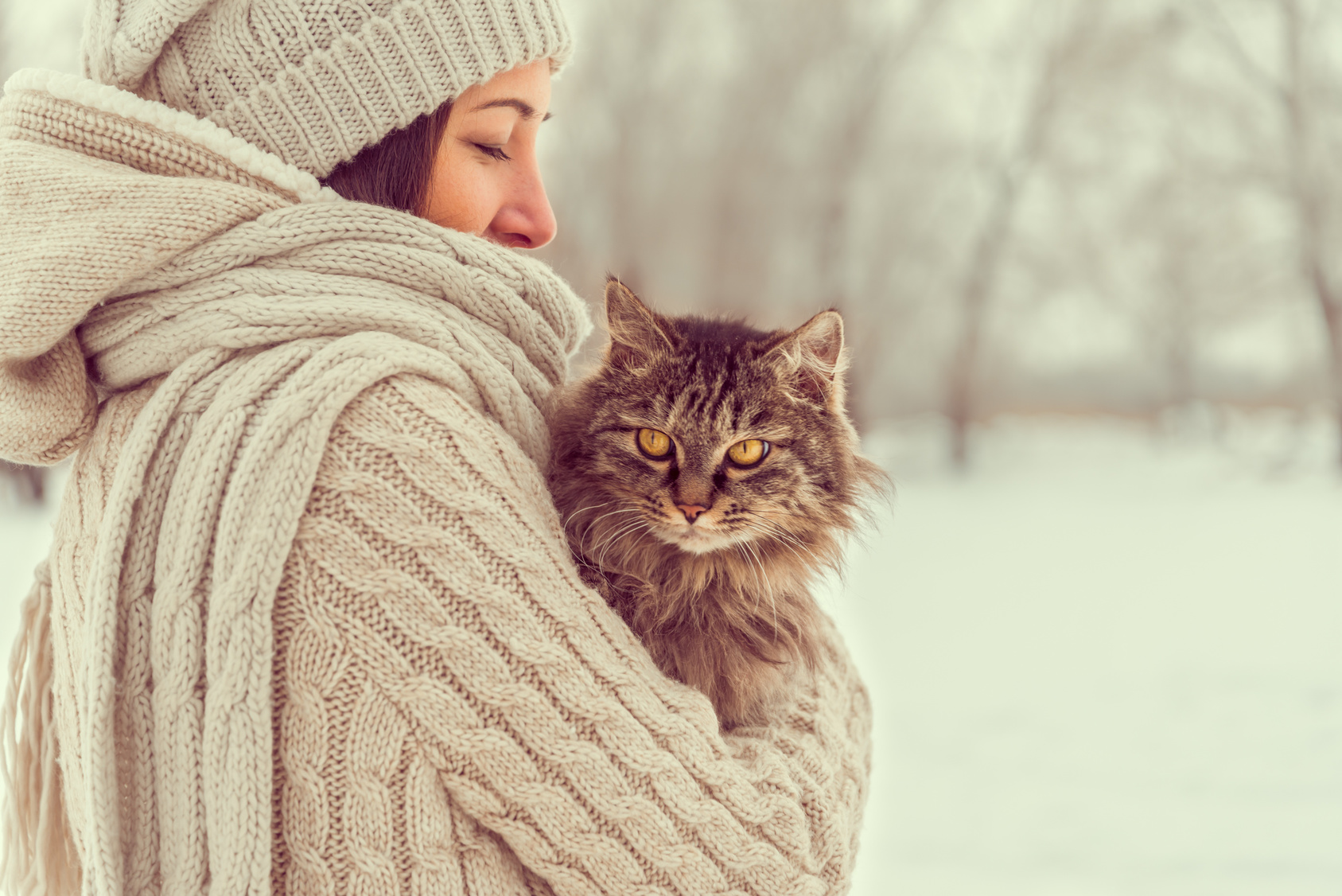 Woman holds a cat