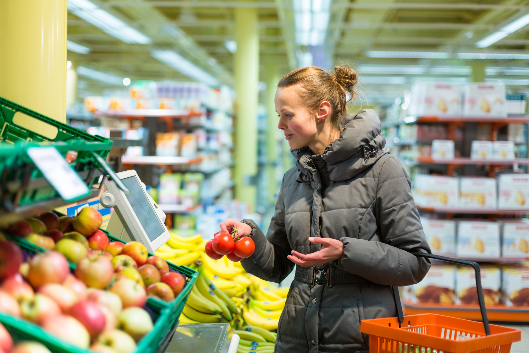 Beautiful, young woman shopping for fruits and vegetables