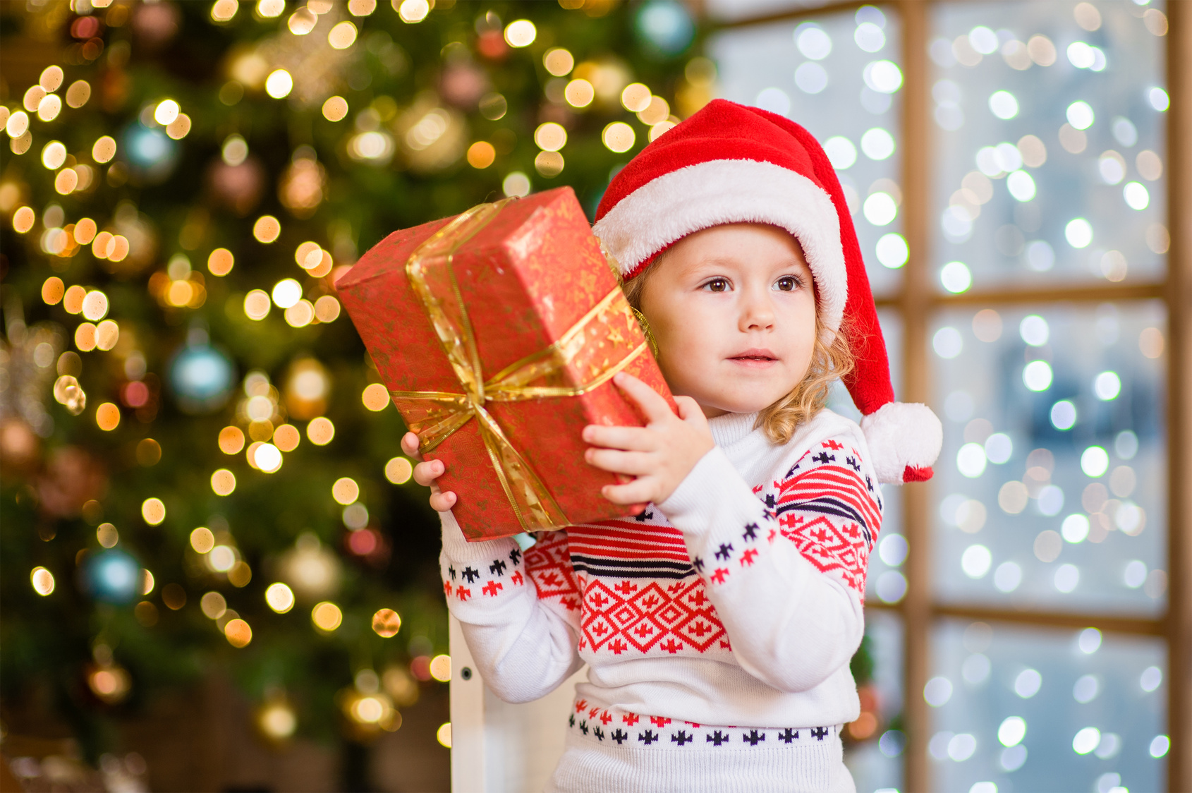 Little girl with christmas gift box