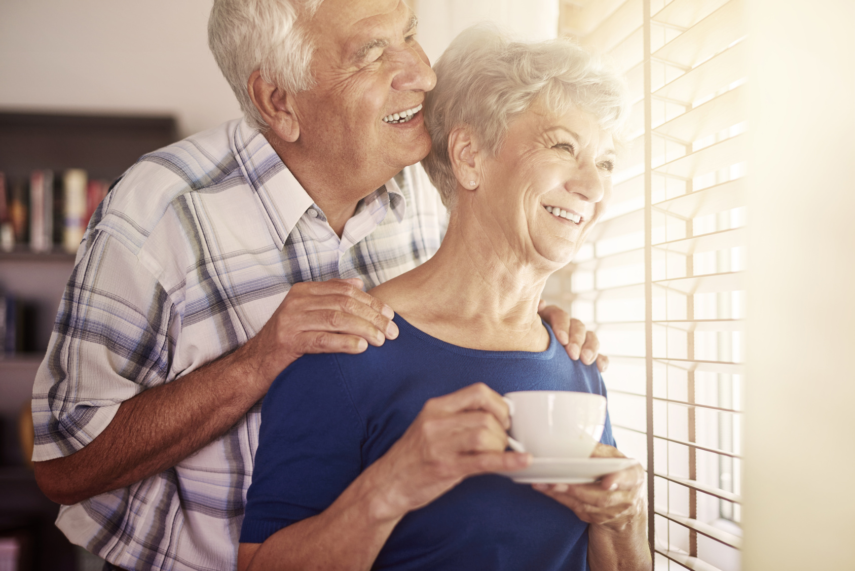 Senior couple next to the window