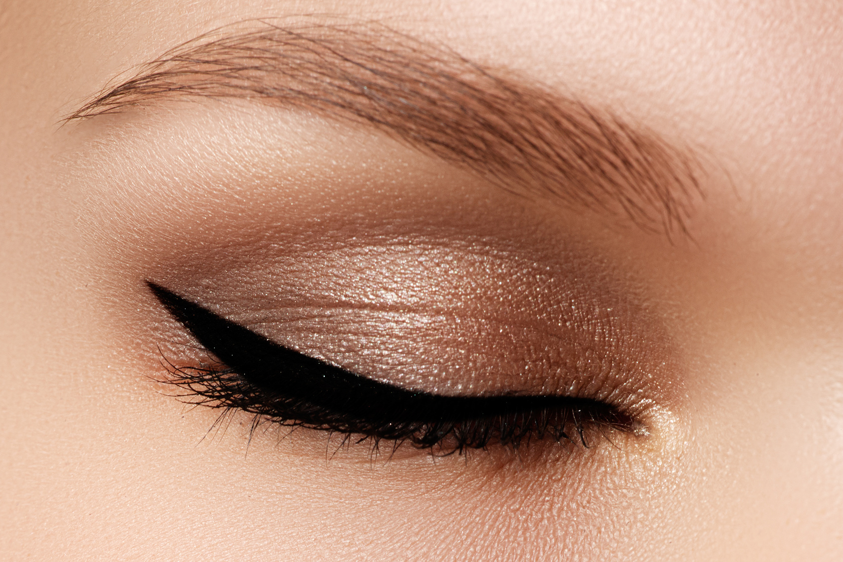 Cosmetics & make-up. Beautiful female eye with sexy black liner