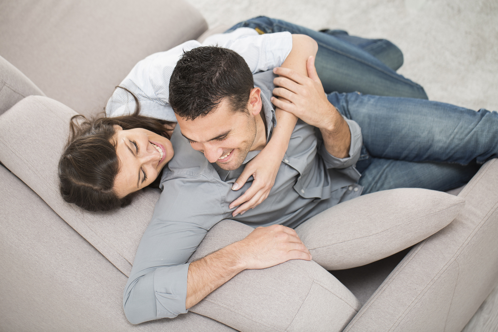 happy couple on a sofa