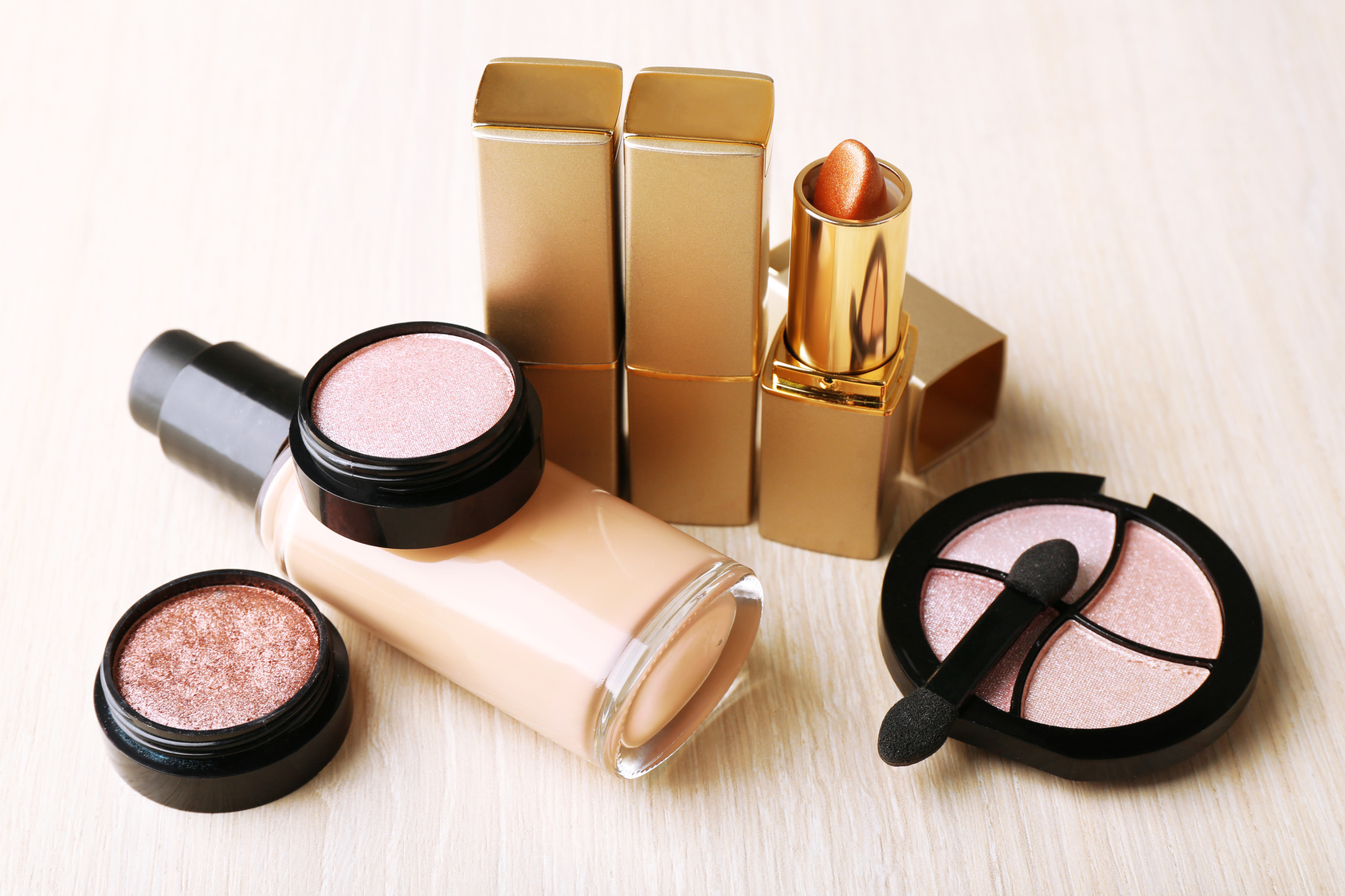 Set of decorative cosmetics on wooden table background