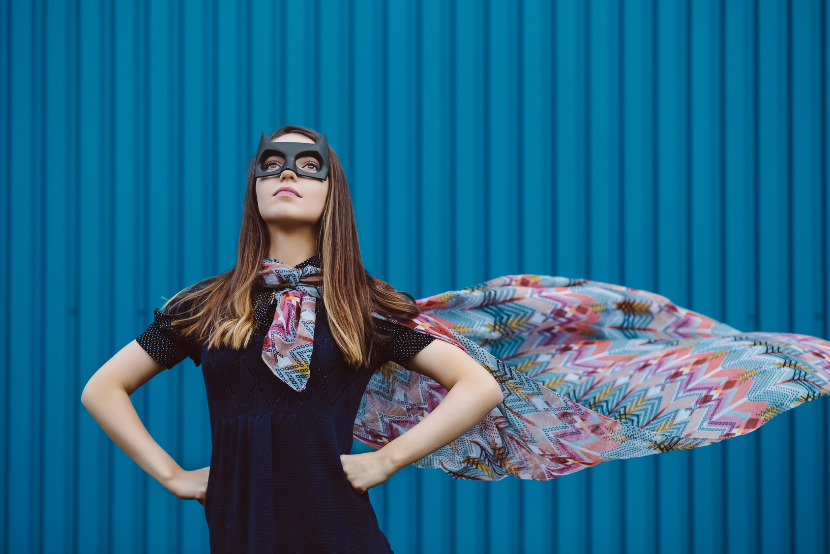 Girl in black superhero mask