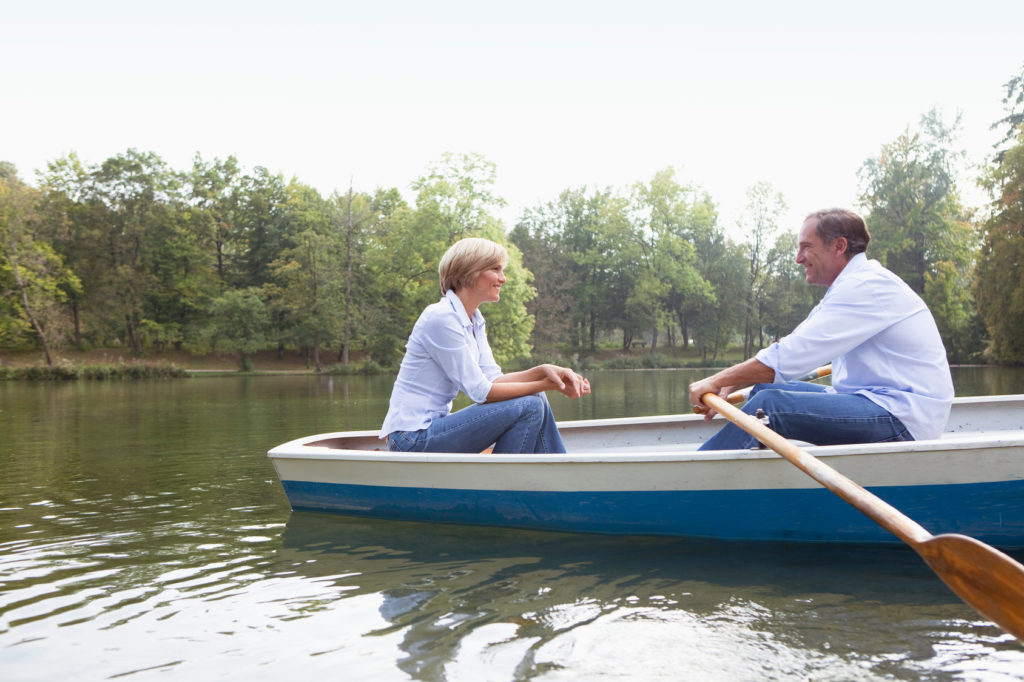 Middle aged couple in a rowboat