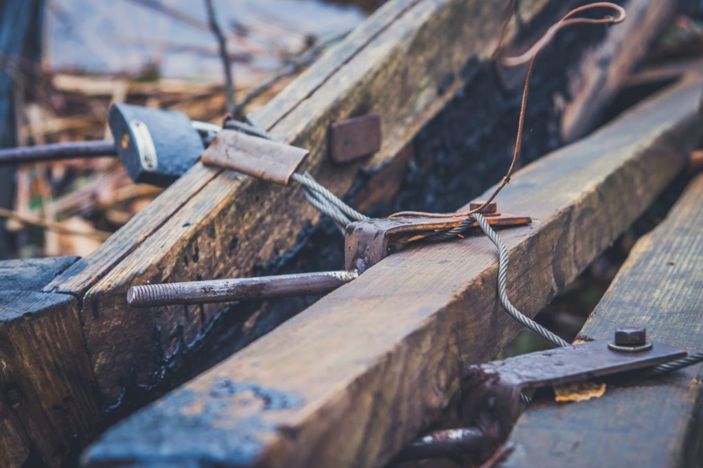 An old wooden boat with oars, rope and other gear. Closed oars