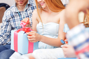 Girl opens her birthday present