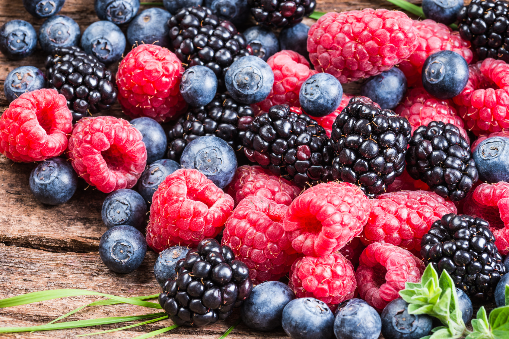 Fresh berries, blueberry, raspberry, blackberry closeup background.