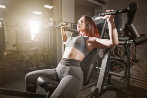 The fitness woman weightlifting workout in gym