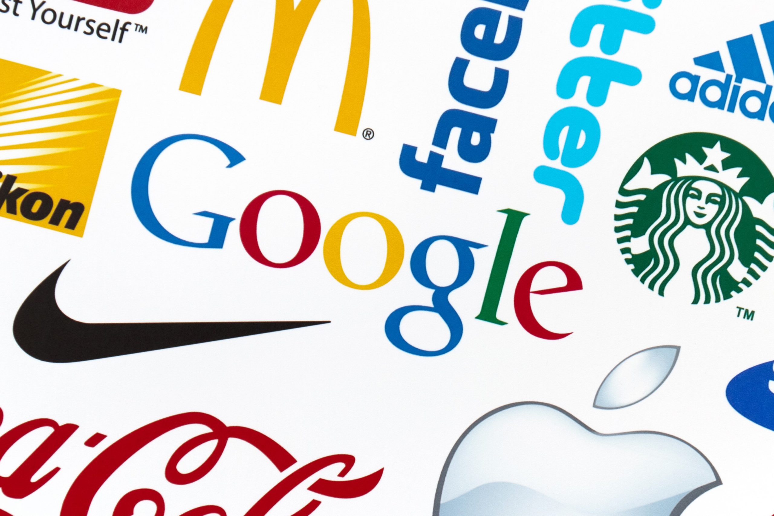 Kiev, Ukraine – February 21, 2012: A logotype collection of well-known world brand’s printed on paper. Include Google, McDonald’s, Nike, Coca-Cola, Facebook, Apple, Yahoo,  YouTube, and other logos.