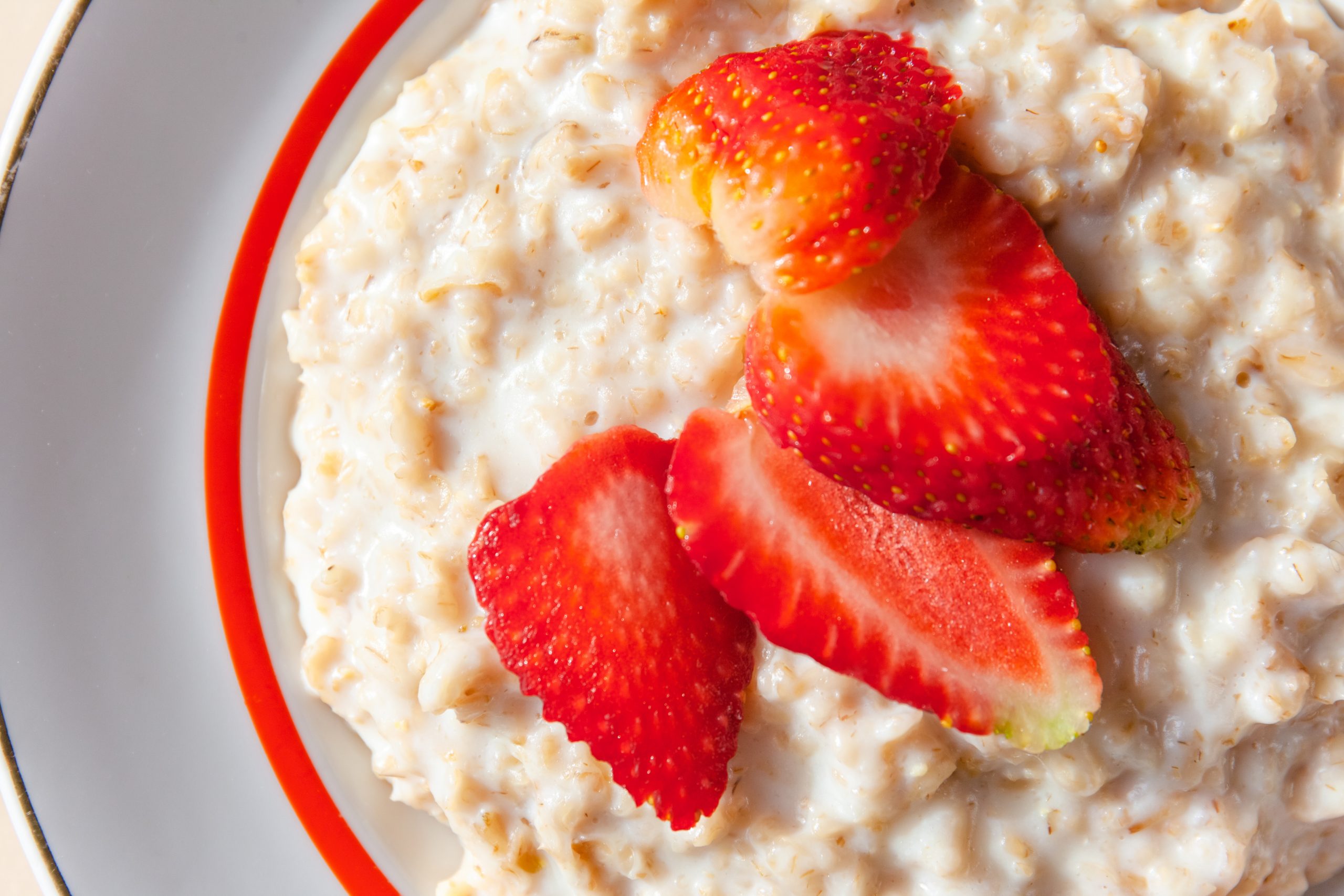 healthy breakfast of oatmeal with strawberries, close up