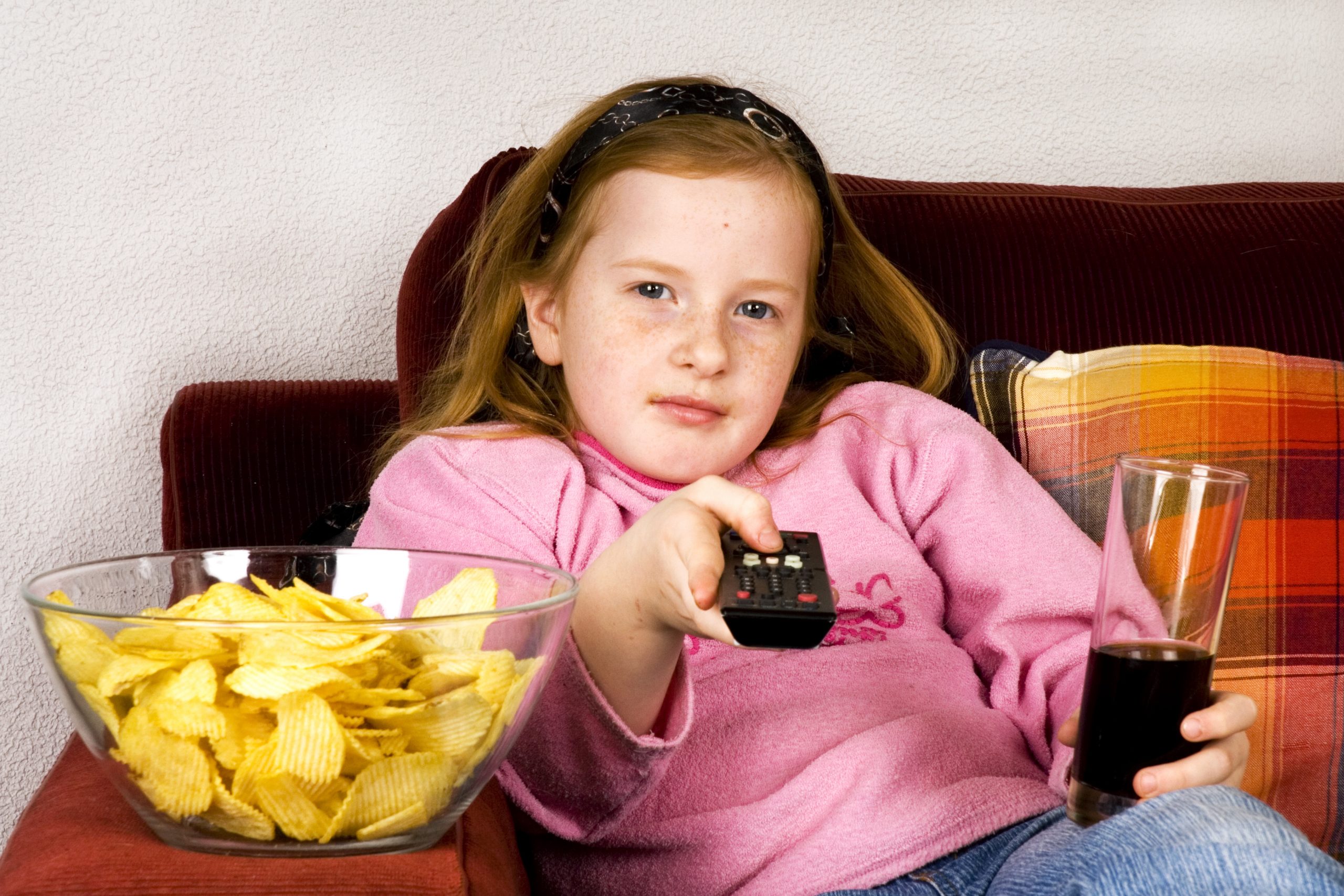 little girl is zapping TV