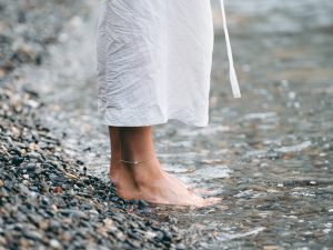 barefoot woman in water